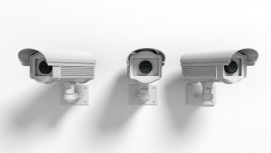 Three security surveillance cameras isolated on white background